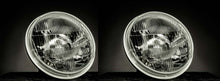 Load image into Gallery viewer, Koito H4 Headlight Upgrade Kit pair with clear lenses for enhanced road illumination.