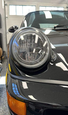 Close-up of AC Excellence Series LED headlights installed on an air-cooled Porsche.