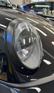 LED headlights for air cooled Porsches installed on a classic model, showcasing sleek design and advanced lighting technology.