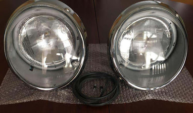 Restored 911 SWB Hella Sealed Beam Headlights with chrome trim rings.