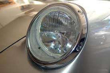 Load image into Gallery viewer, SEV Marchal Amplilux Headlights on vintage car, chrome trim, clear lens