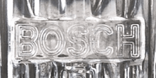 Load image into Gallery viewer, Close-up of Bosch logo on Porsche 911 fog light lens from 1974-1983.
