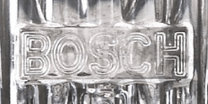 Close-up of Bosch logo on Porsche 911 fog light lens from 1974-1983.