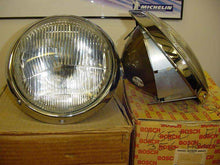 Load image into Gallery viewer, Bosch 4487 flat fluted lens headlight, clear and amber lenses on Bosch packaging.