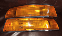 Load image into Gallery viewer, Restored Porsche 911 SWB turn signals showcasing premium chrome and high-quality amber lenses.