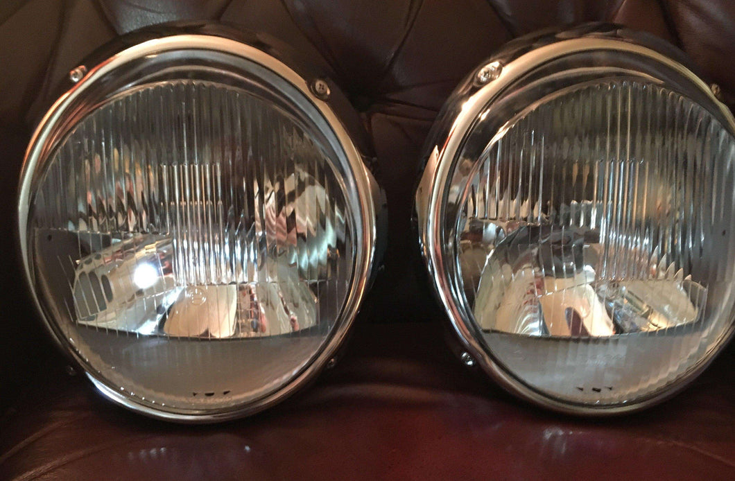 Restored Bosch H1 Headlights on leather surface.