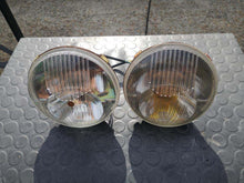 Load image into Gallery viewer, SEV Marchal Amplilux Headlights restoration services display.
