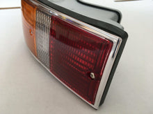 Load image into Gallery viewer, Restored Porsche 911/912 F-Series tail light with red and amber lenses.