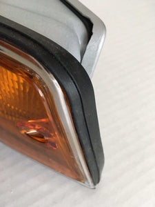Restored Porsche 911/912 F-Series tail light close-up with new gasket and lens.