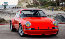 Load image into Gallery viewer, Vintage Porsche 911 with restored Cibié Bi-Iode headlights, parked by the beach.