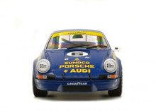 Load image into Gallery viewer, Cibié Bi-Iode headlights on vintage blue Porsche 911, front view, showcasing restoration service reliability.